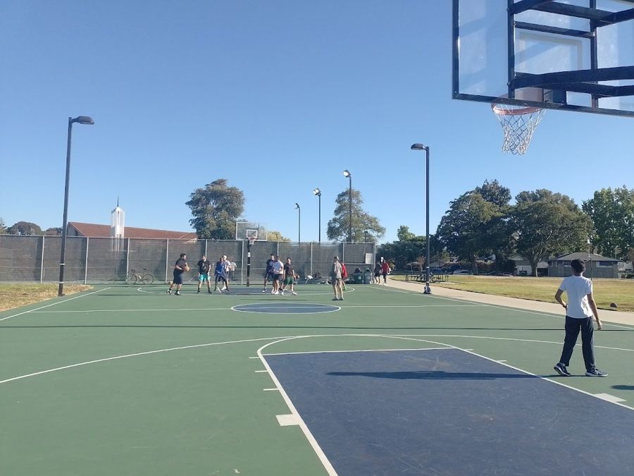 Catamaran Park basketball court with light poles.